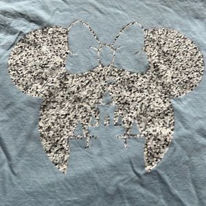 Blue t-shirt with Minnie Mouse emblem and Disney castle in centre.